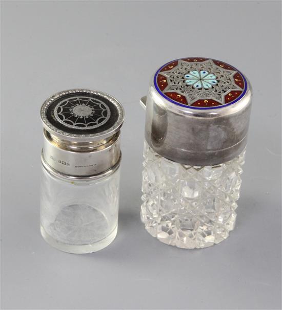 A late Victorian silver and enamel mounted cut glass salts bottle by Sampson Mordan & Co and a similar tortoiseshell bottle.